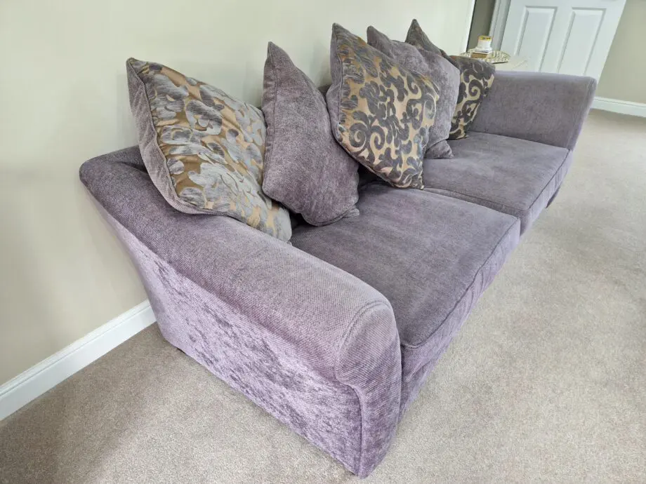 DFS Grey with Gold patterned sofa.