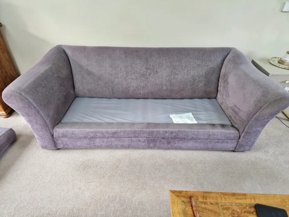DFS Grey with Gold patterned sofa.