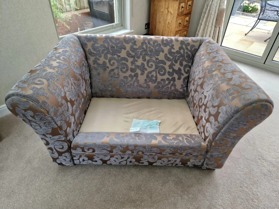 DFS Grey and Gold patterned sofa