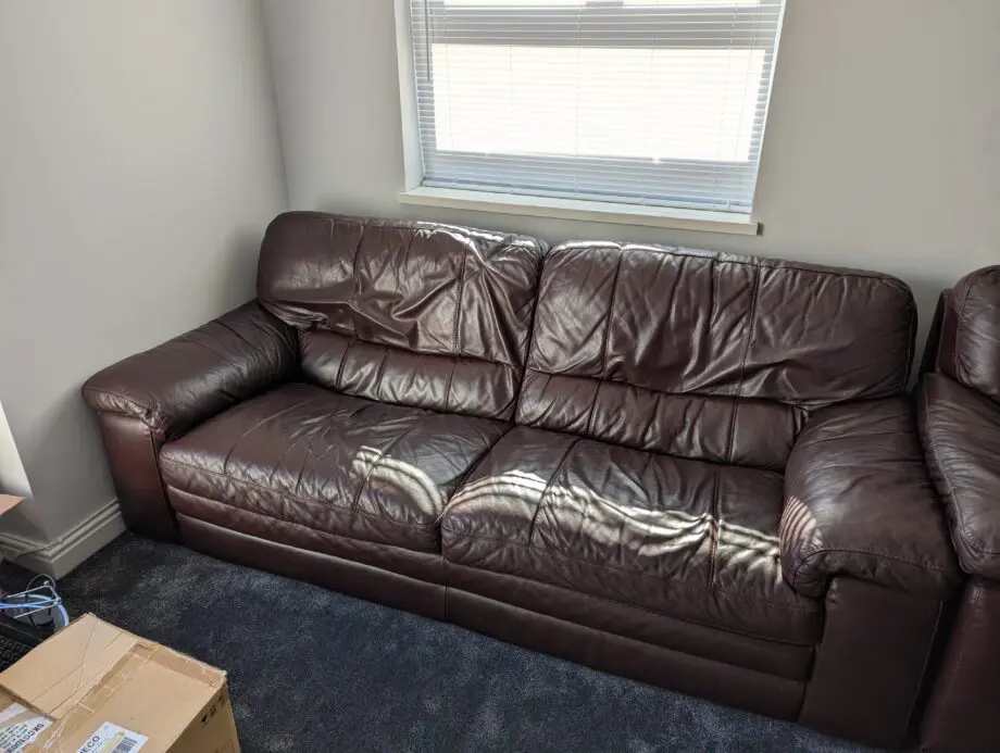 Brown leather three-piece sofa set