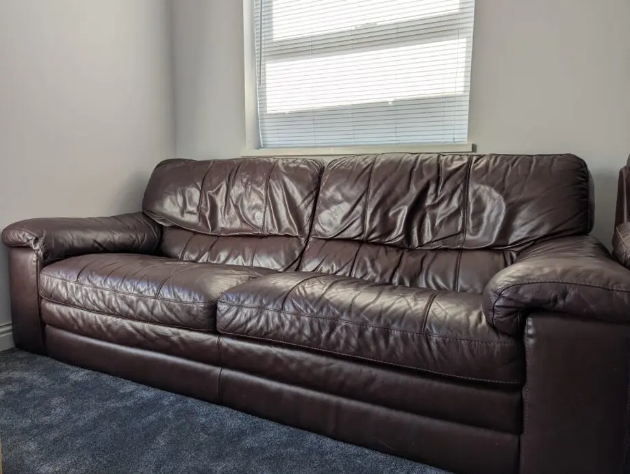 Brown leather three-piece sofa set