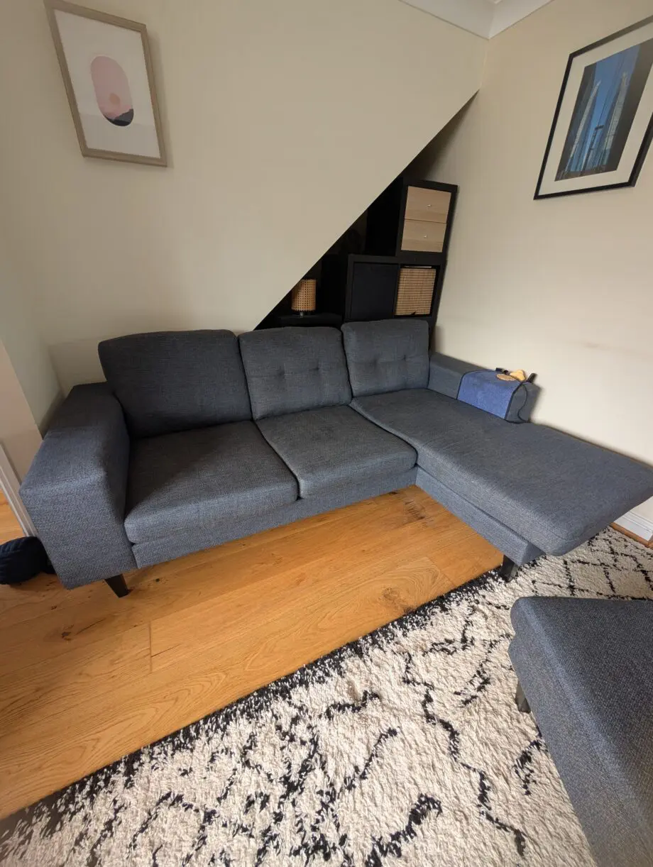 DFS Navy corner sofa and footstool