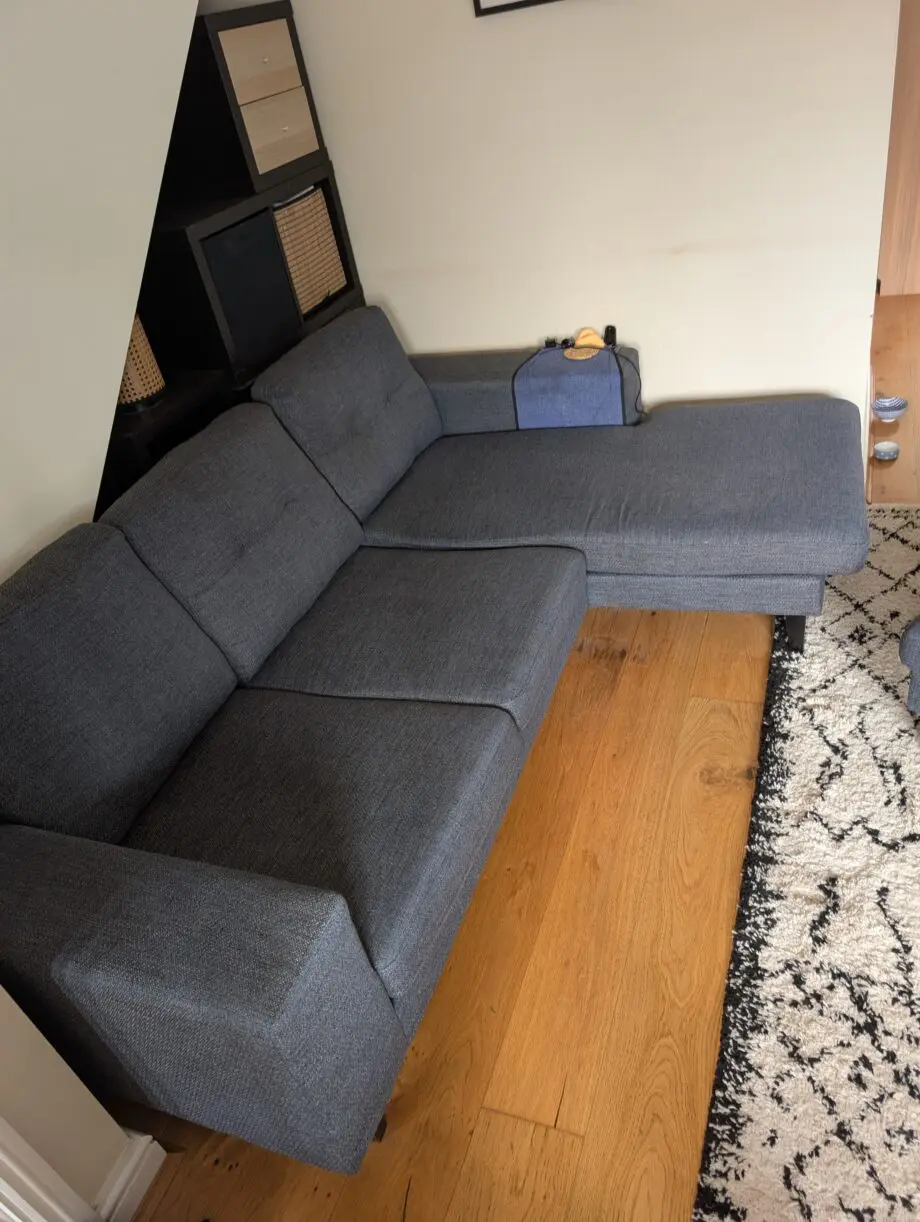 DFS Navy corner sofa and footstool