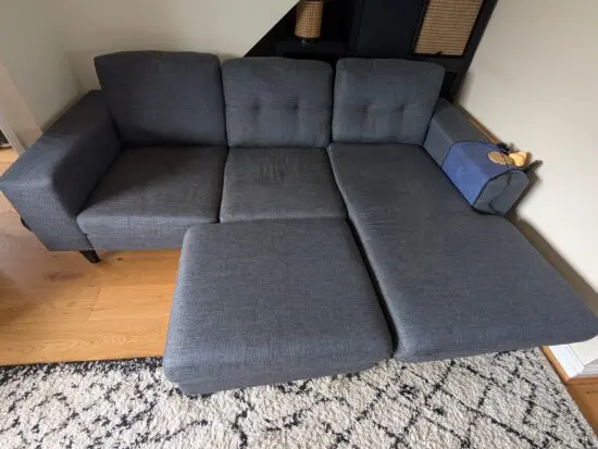 DFS Navy corner sofa and footstool