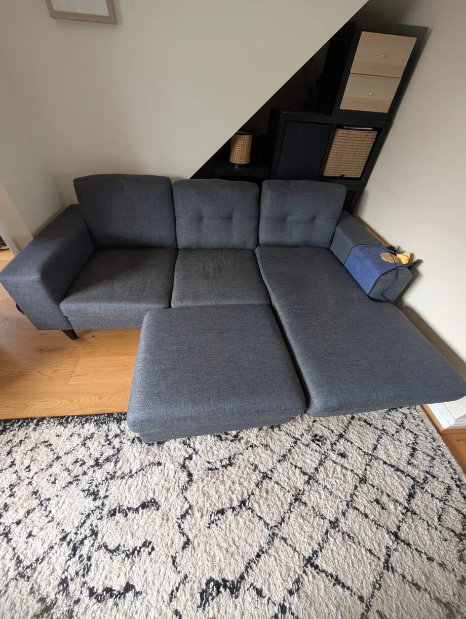 DFS Navy corner sofa and footstool