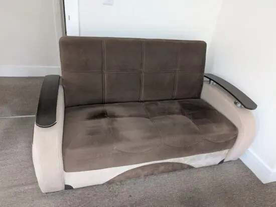 Brown 2 seater sofa with storage