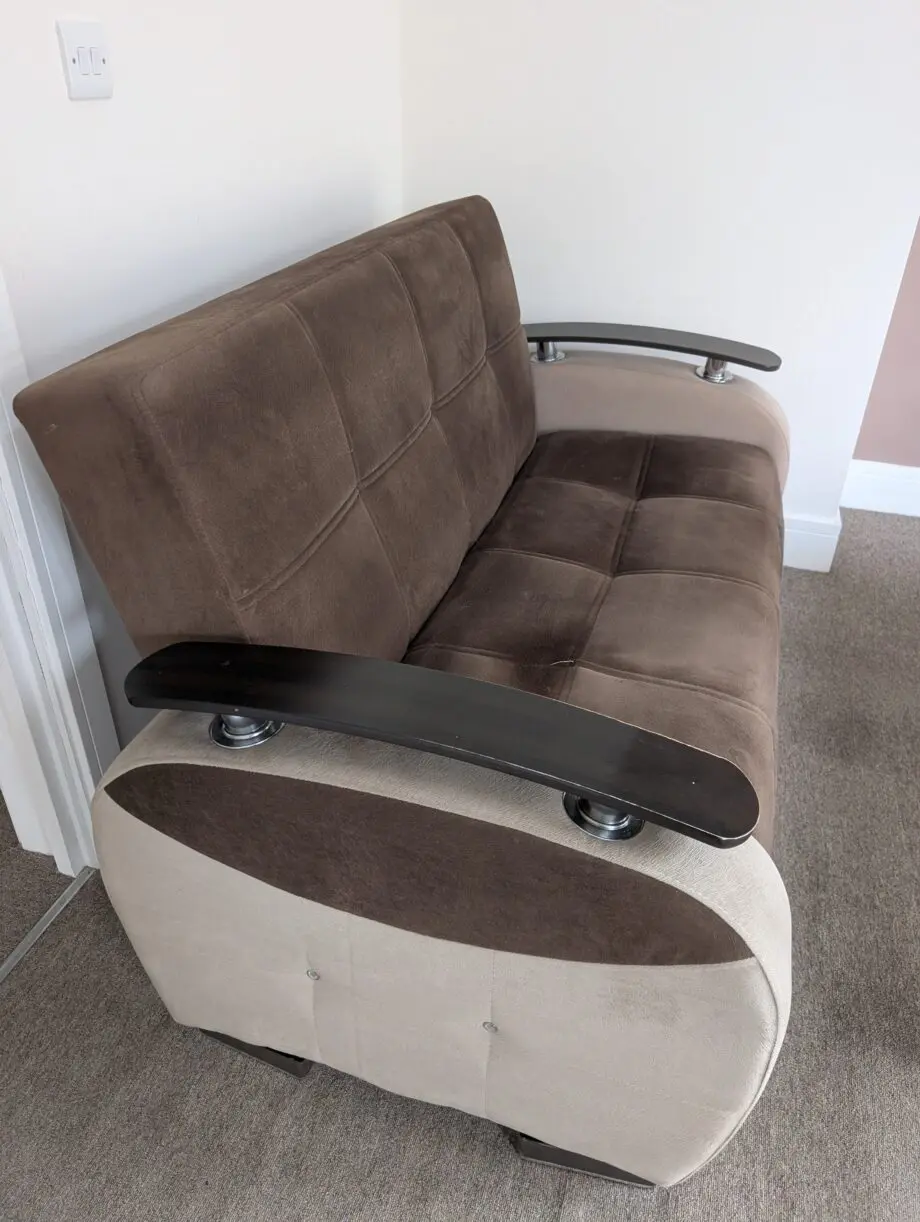 Brown 2 seater sofa with storage