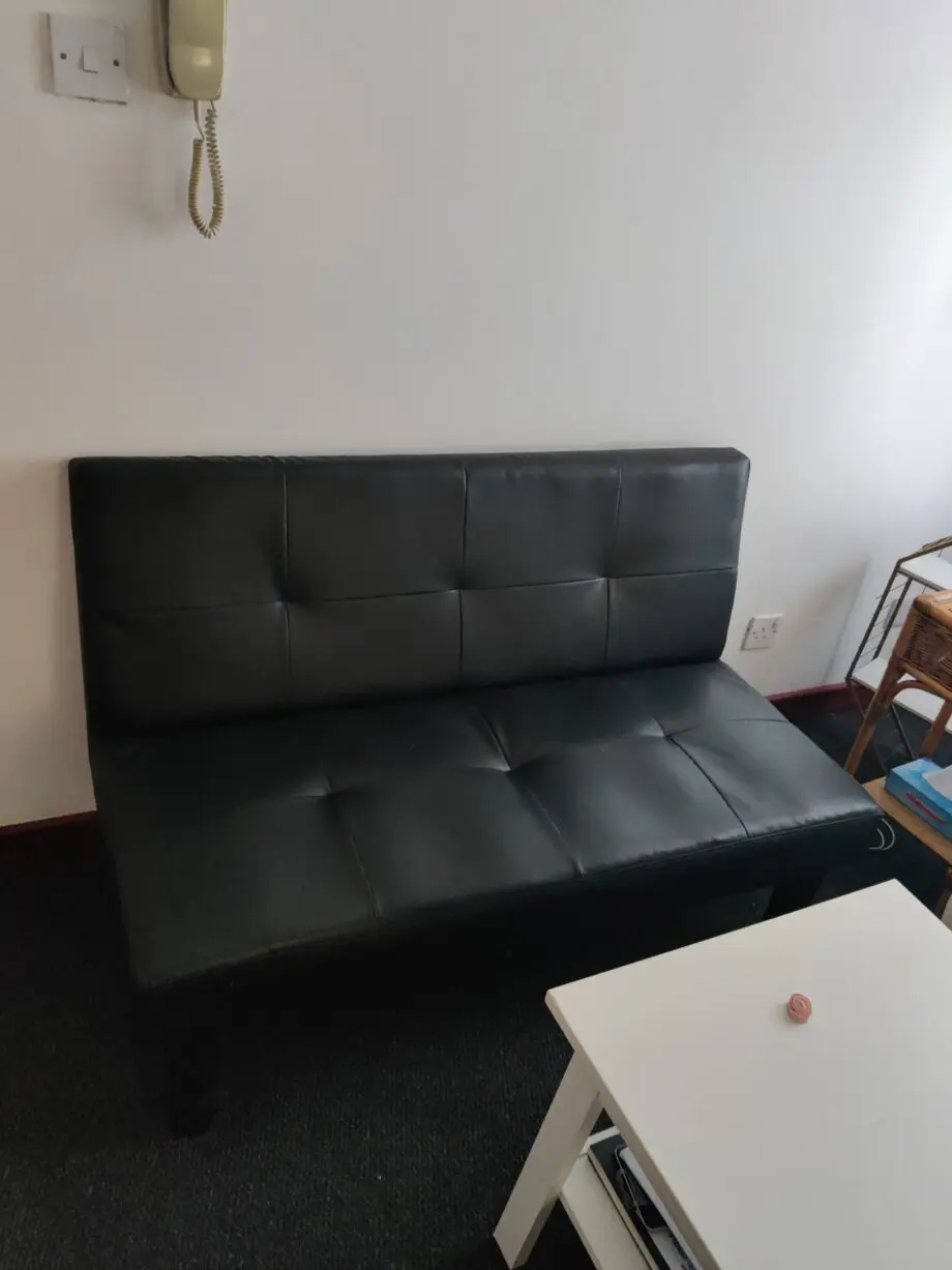 Black two seater sofa