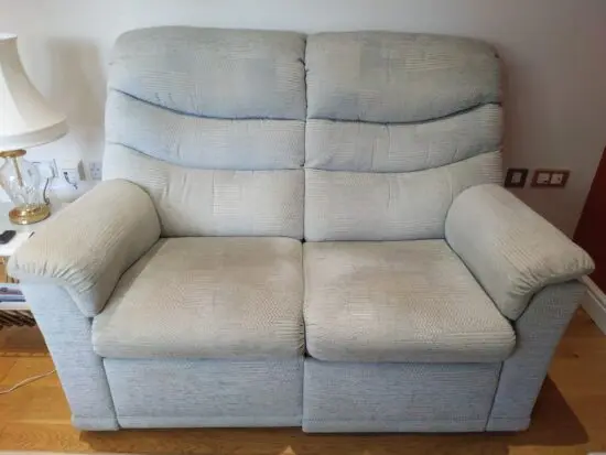 Furniture Village G Plan, high-backed 2 seater recliner sofa in grey with matching footstool