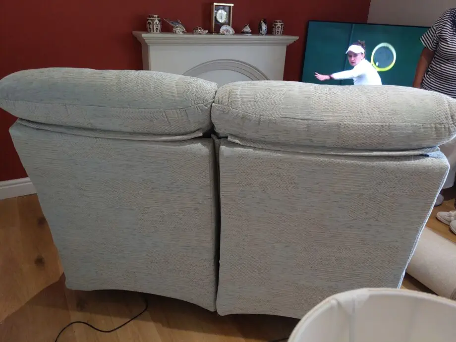 Furniture Village G Plan, high-backed 2 seater recliner sofa in grey with matching footstool
