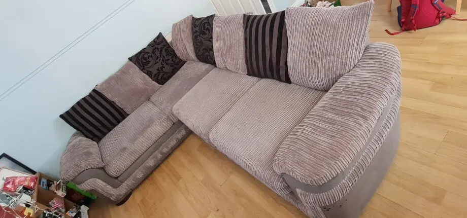 DFS grey corner sofa with scatter cushions
