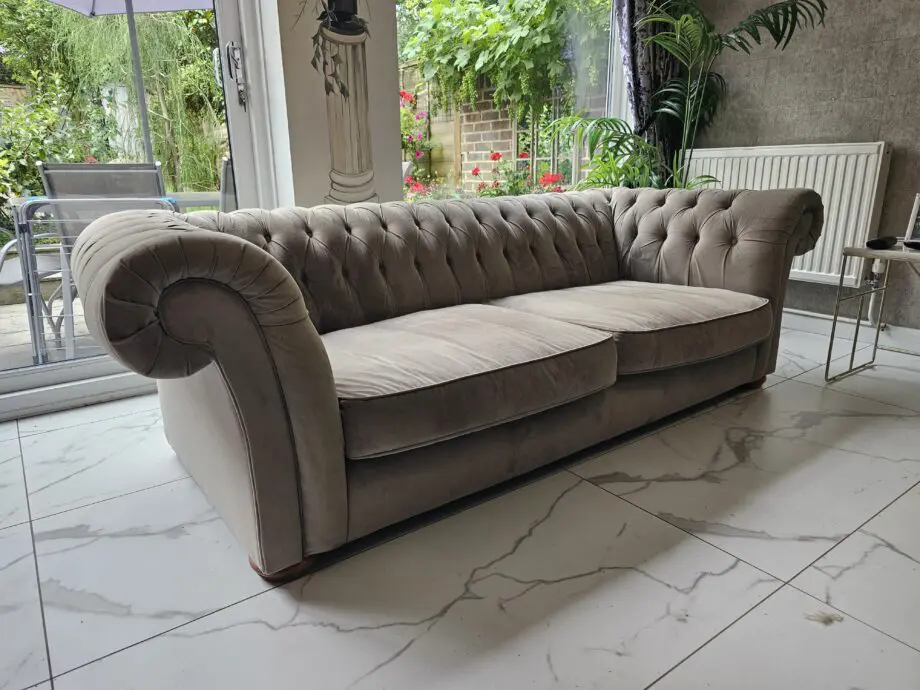 Two grey velvet sofas