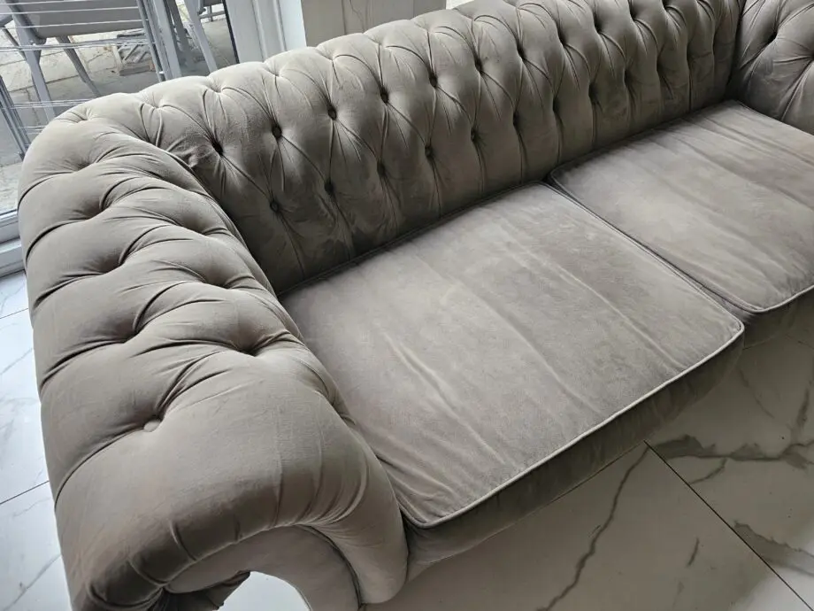 Two grey velvet sofas