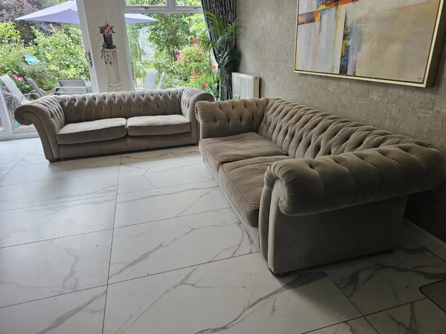 Two grey velvet sofas