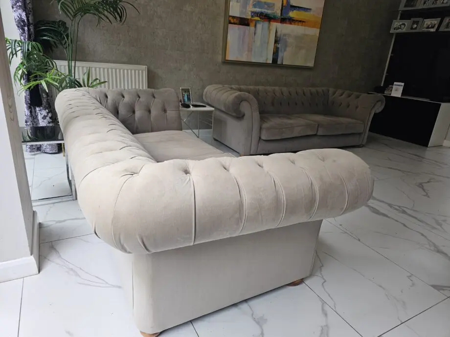 Two grey velvet sofas