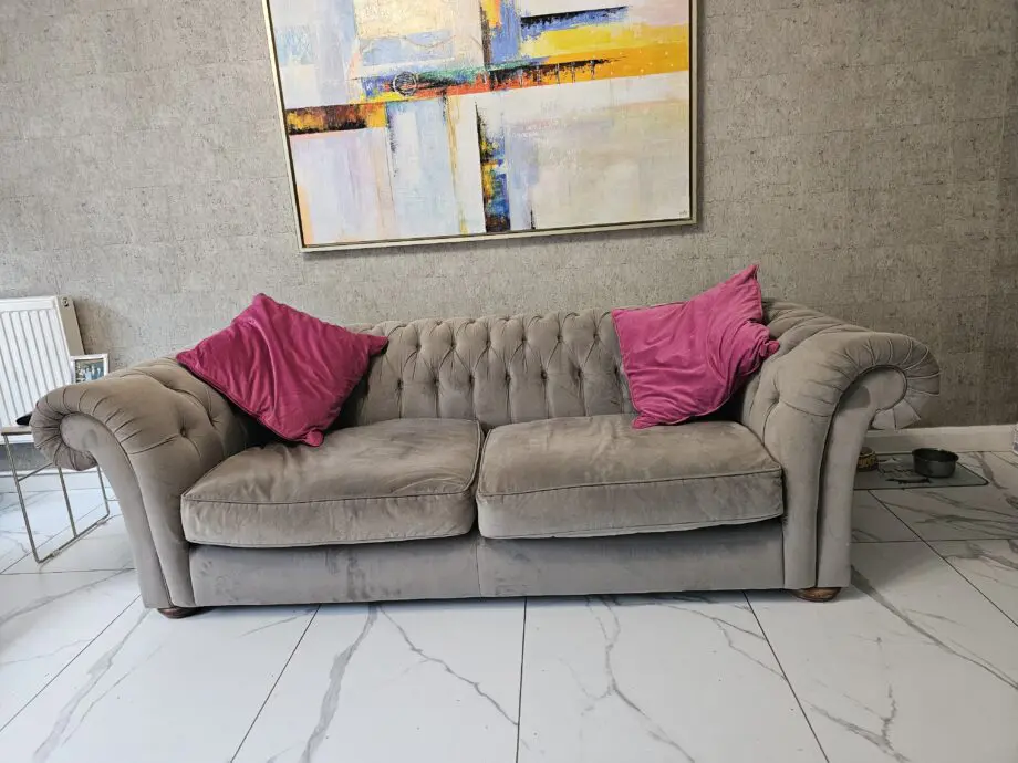 Two grey velvet sofas