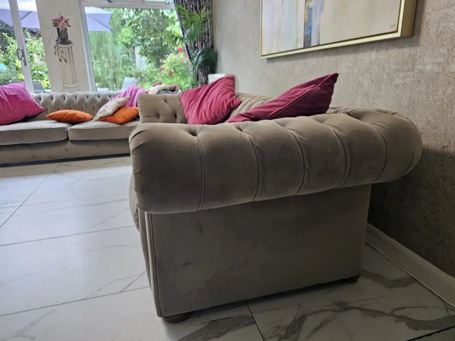 Two grey velvet sofas
