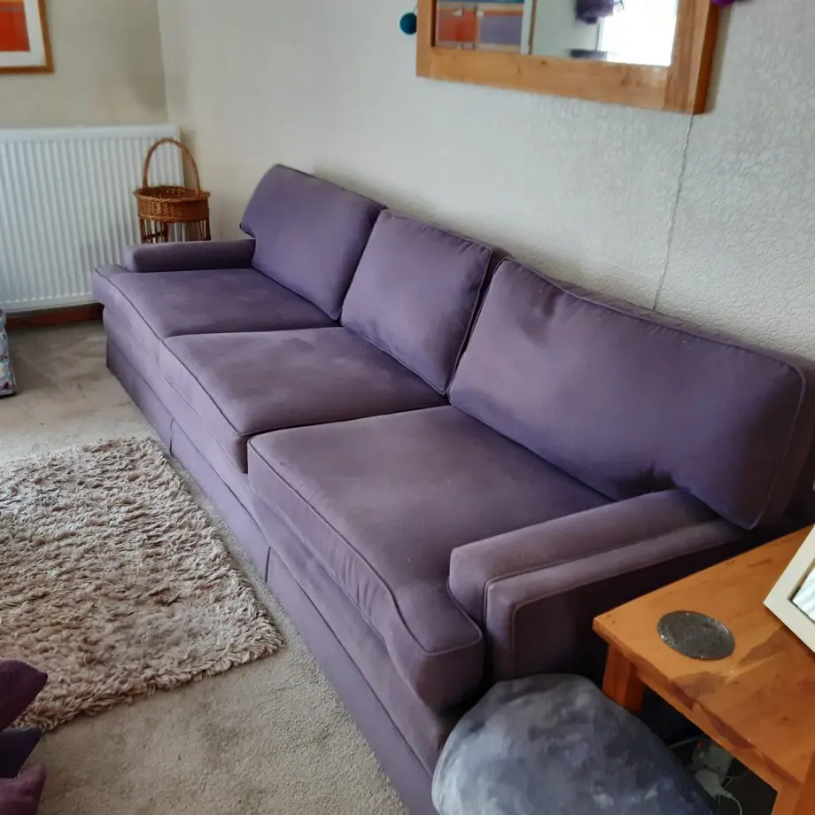 very elegant four seater sofa soft Damson colour