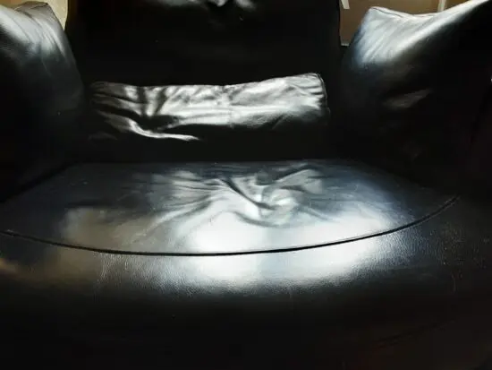 Black Leather swivel cuddle chair