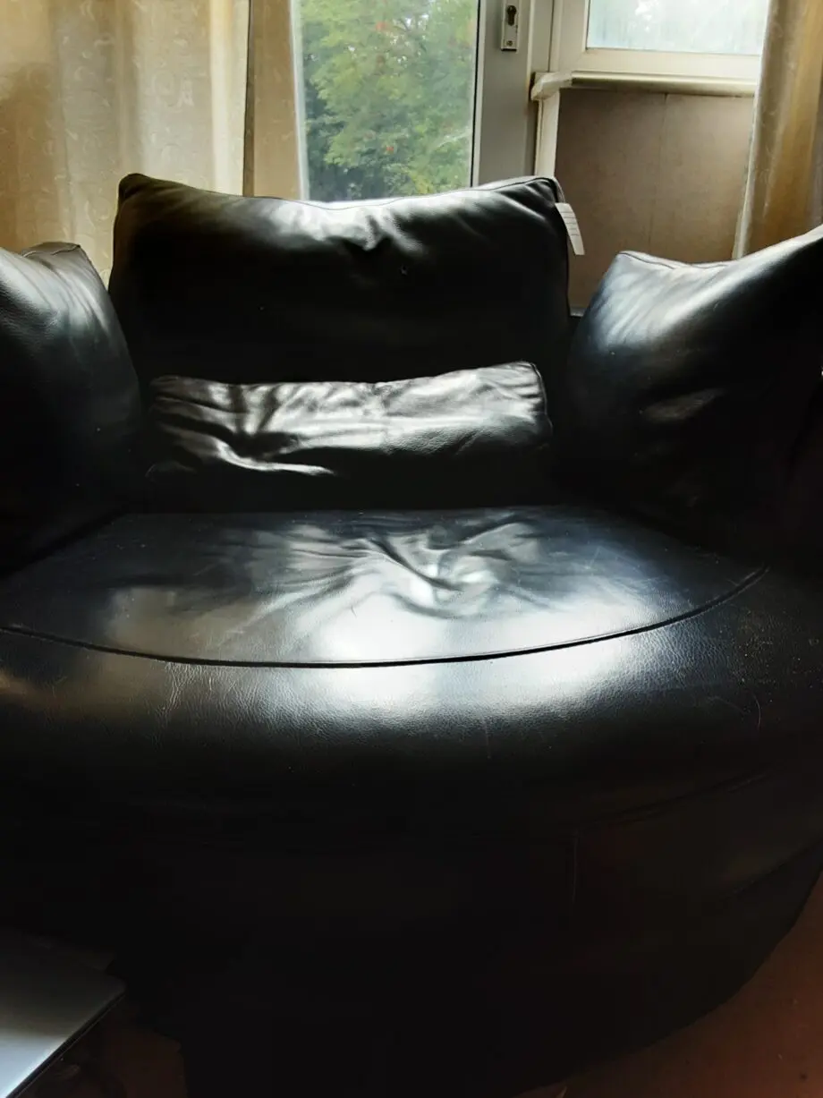 Black Leather swivel cuddle chair