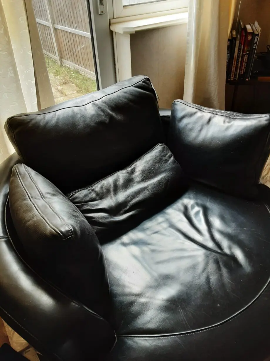Black Leather swivel cuddle chair
