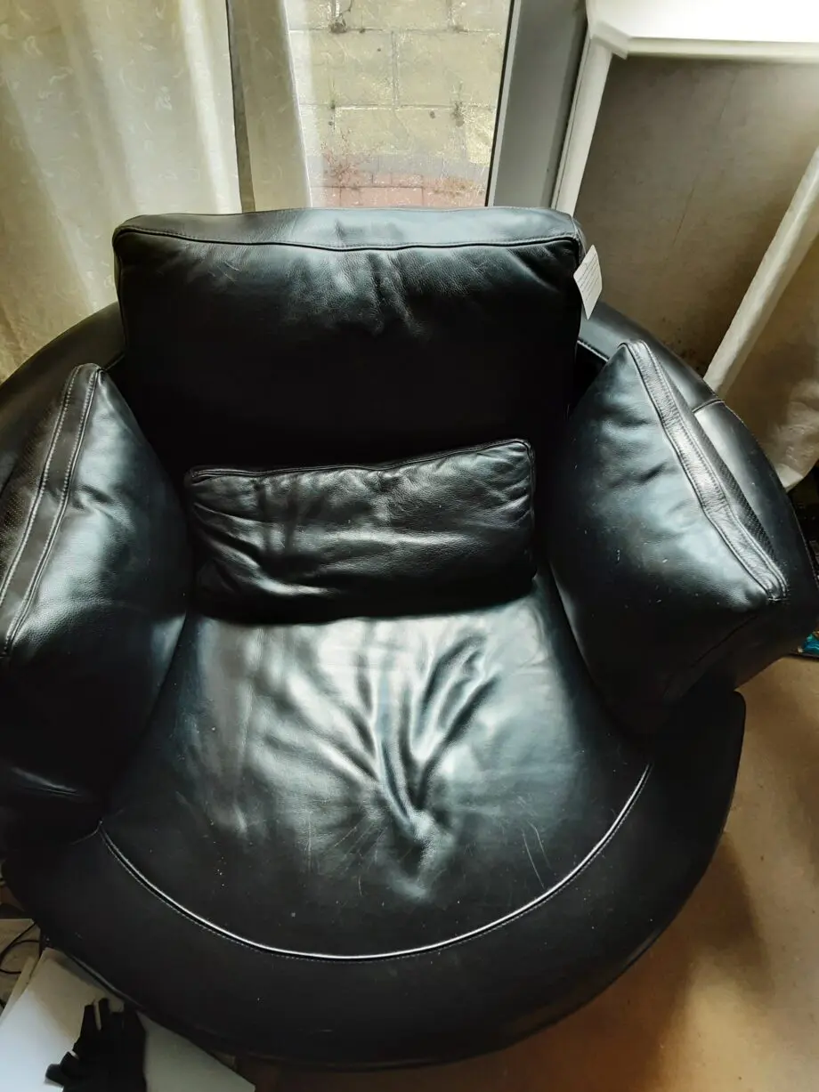 Black Leather swivel cuddle chair