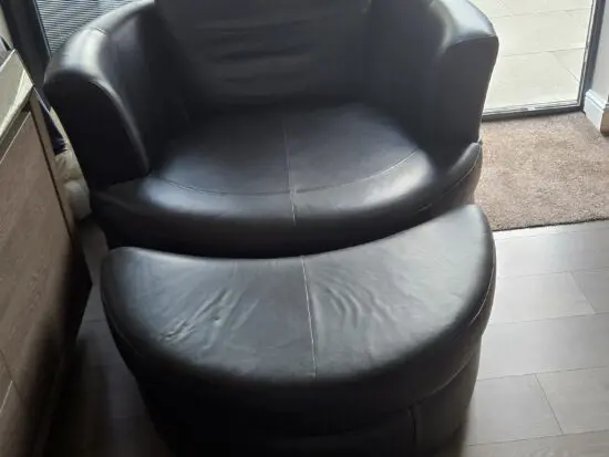 Fantatic DFS Freya 100% Black LeatherCuddle chair plus footstall