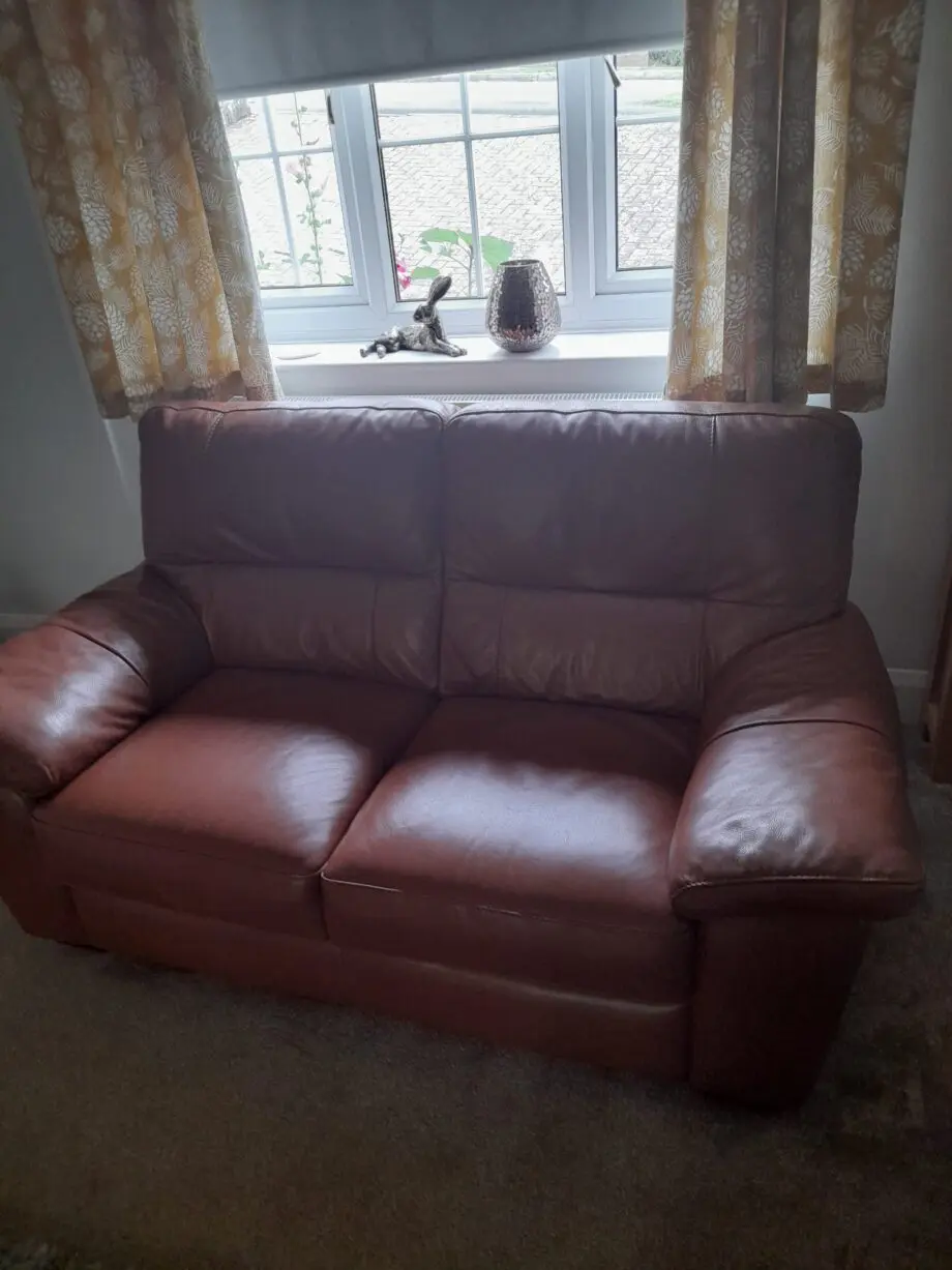 2 seater leather sofa with storage pouffe