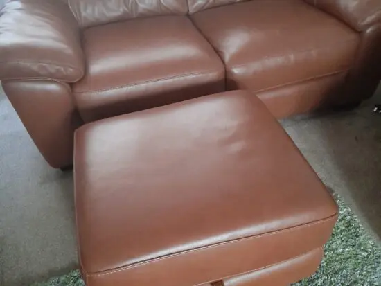 BARGAIN 2 seater leather sofa with storage pouffe