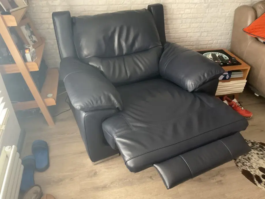 DFS Reclining leather arm chair.
