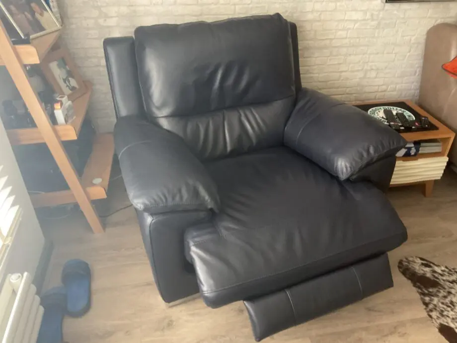 DFS Reclining leather arm chair.