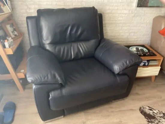 DFS Reclining leather arm chair.