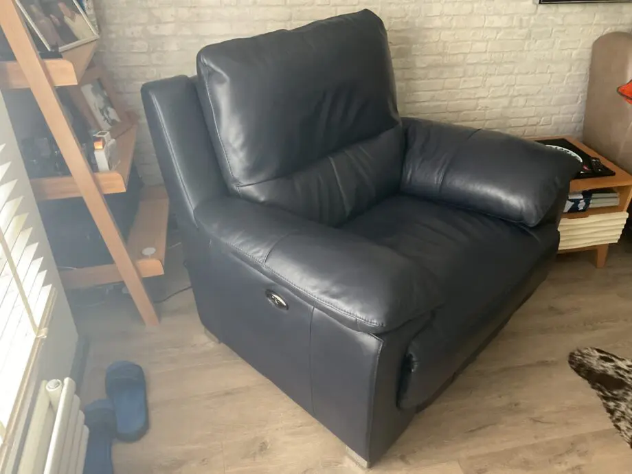 DFS Reclining leather arm chair.