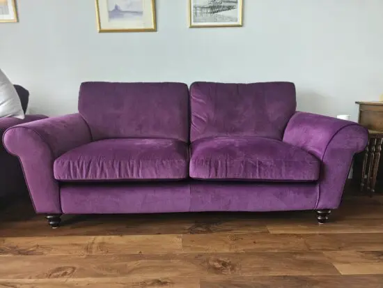 Purple velvet 3 seater sofa with 2 armchairs and a footstool