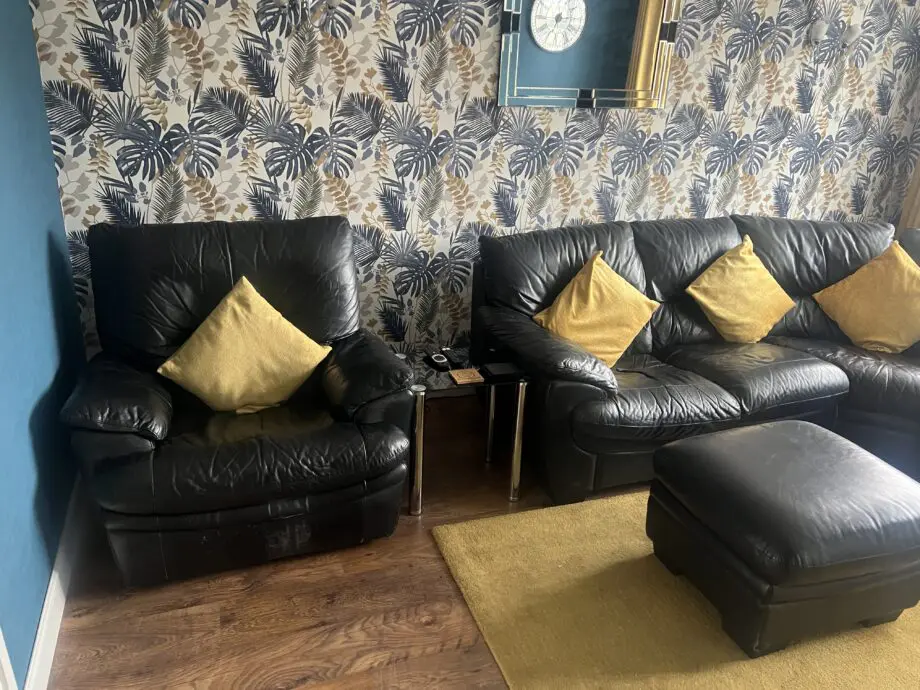 DFS black leather corner sofa & chair