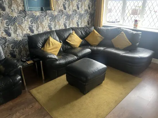 DFS black leather corner sofa & chair