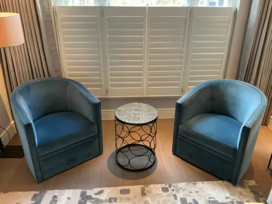 Sofa & Chair Company Bespoke Velvet Swivel Club Chairs with Bronze detailing