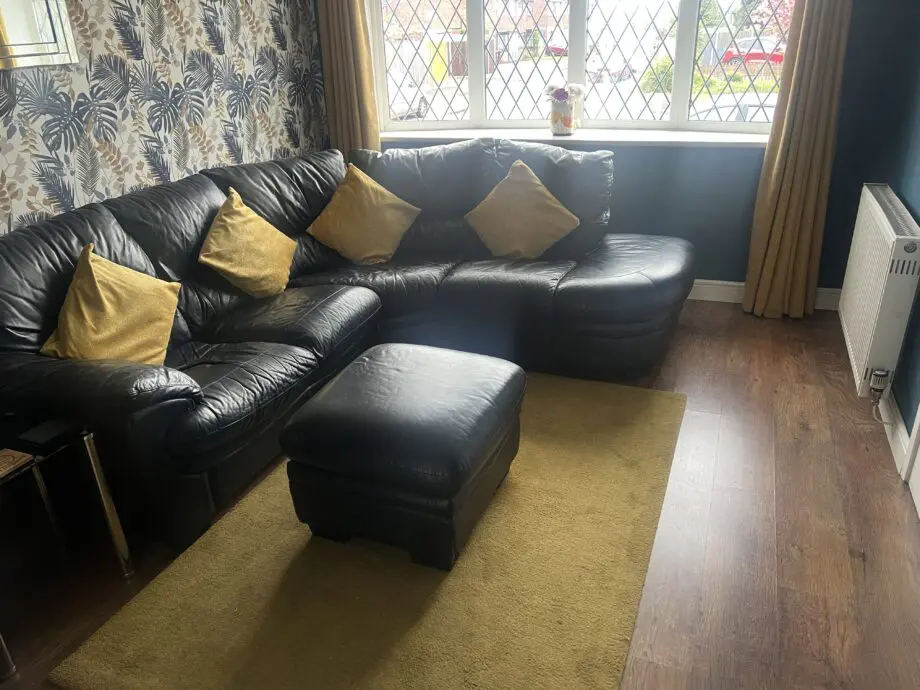 DFS black leather corner sofa & chair