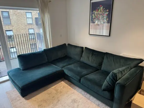 DFS Green velvet corner sofa