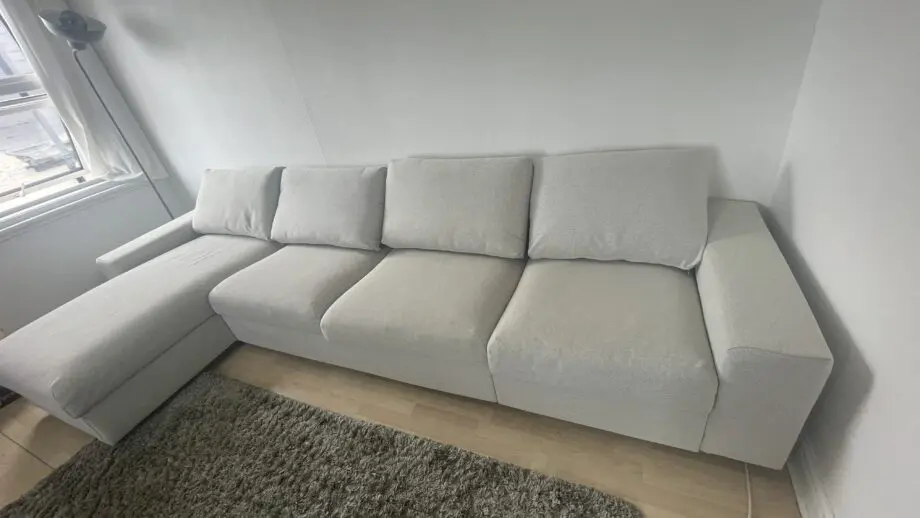 Ikea, grey 4 seat sofa bed with chaise long storage.