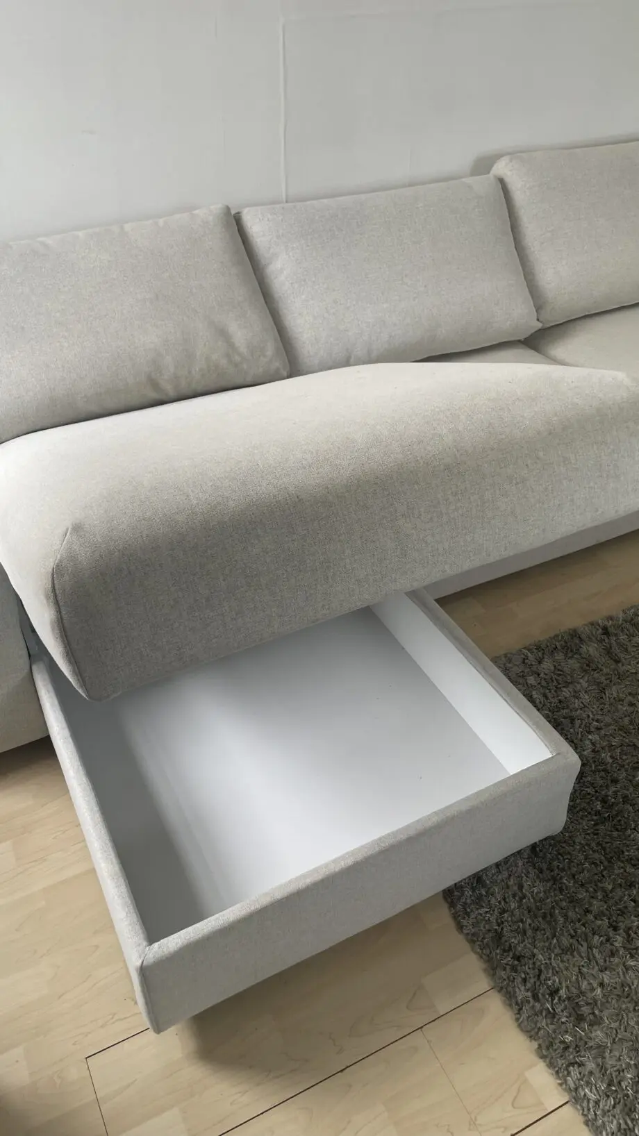 Ikea, grey 4 seat sofa bed with chaise long storage.