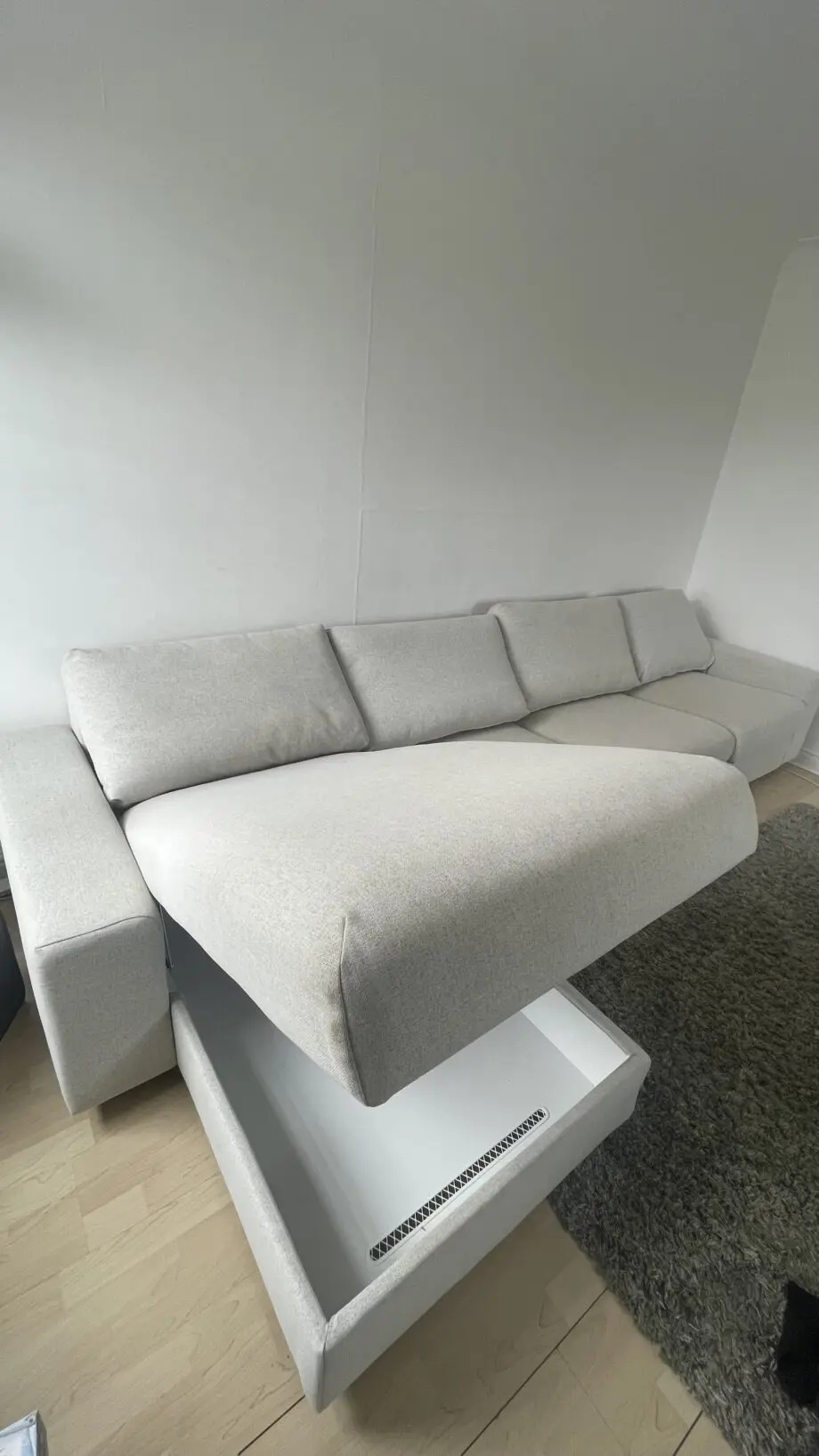 Ikea, grey 4 seat sofa bed with chaise long storage.