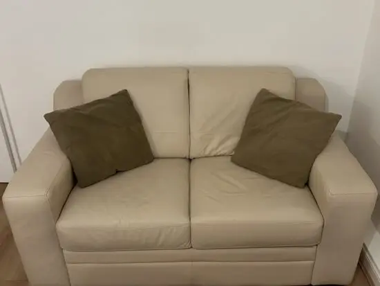 DFS Cream Leather Two Seater Sofa