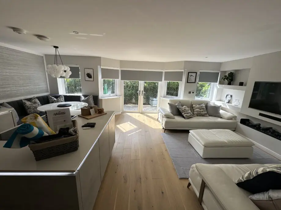 Artemis white leather sofa and footstool