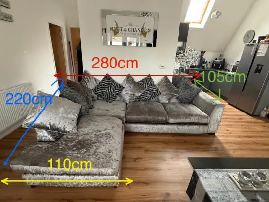 Crushed velvet grey corner sofa from DFS with matching footstool with storage