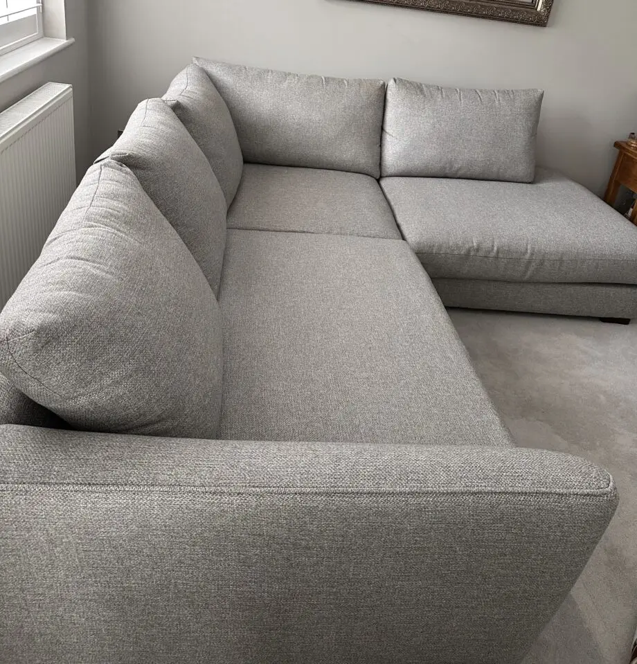 Corner sofa with an armchair and a footstool