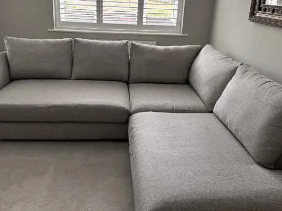 Corner sofa with an armchair and a footstool