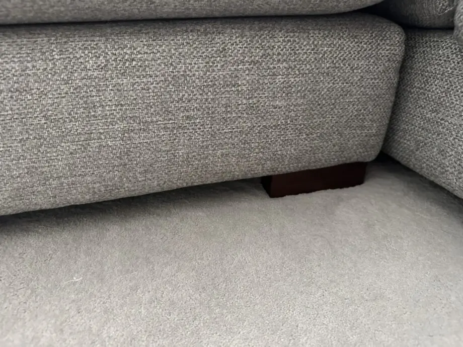 Corner sofa with an armchair and a footstool