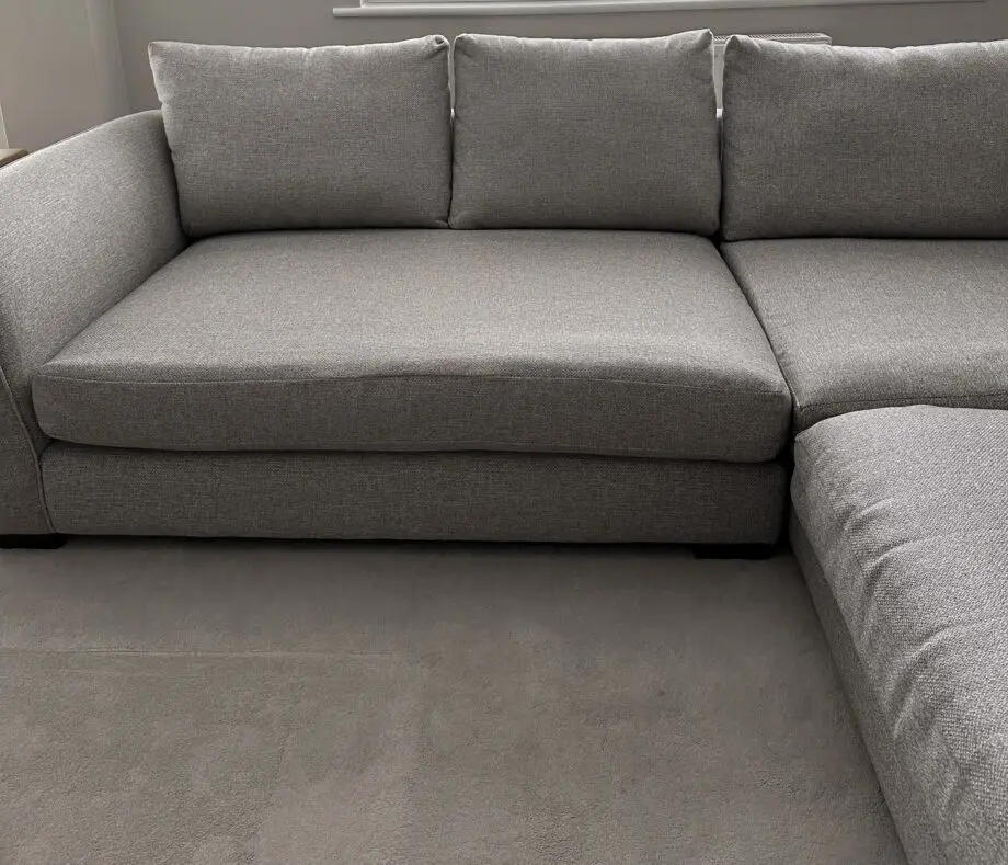Corner sofa with an armchair and a footstool