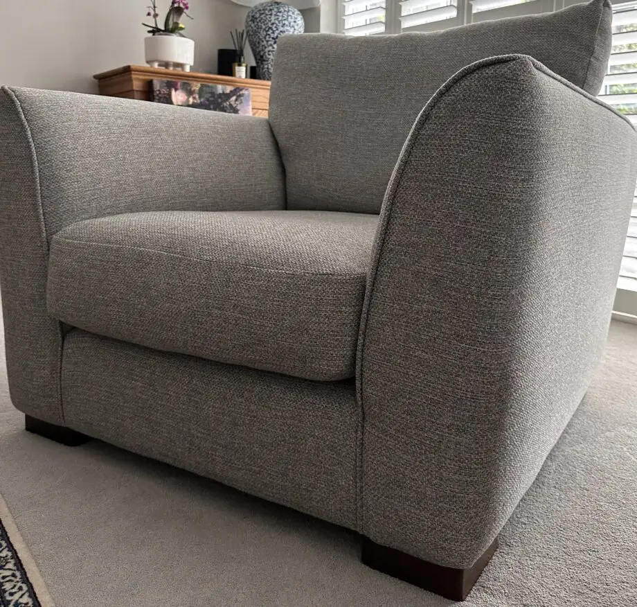 Corner sofa with an armchair and a footstool